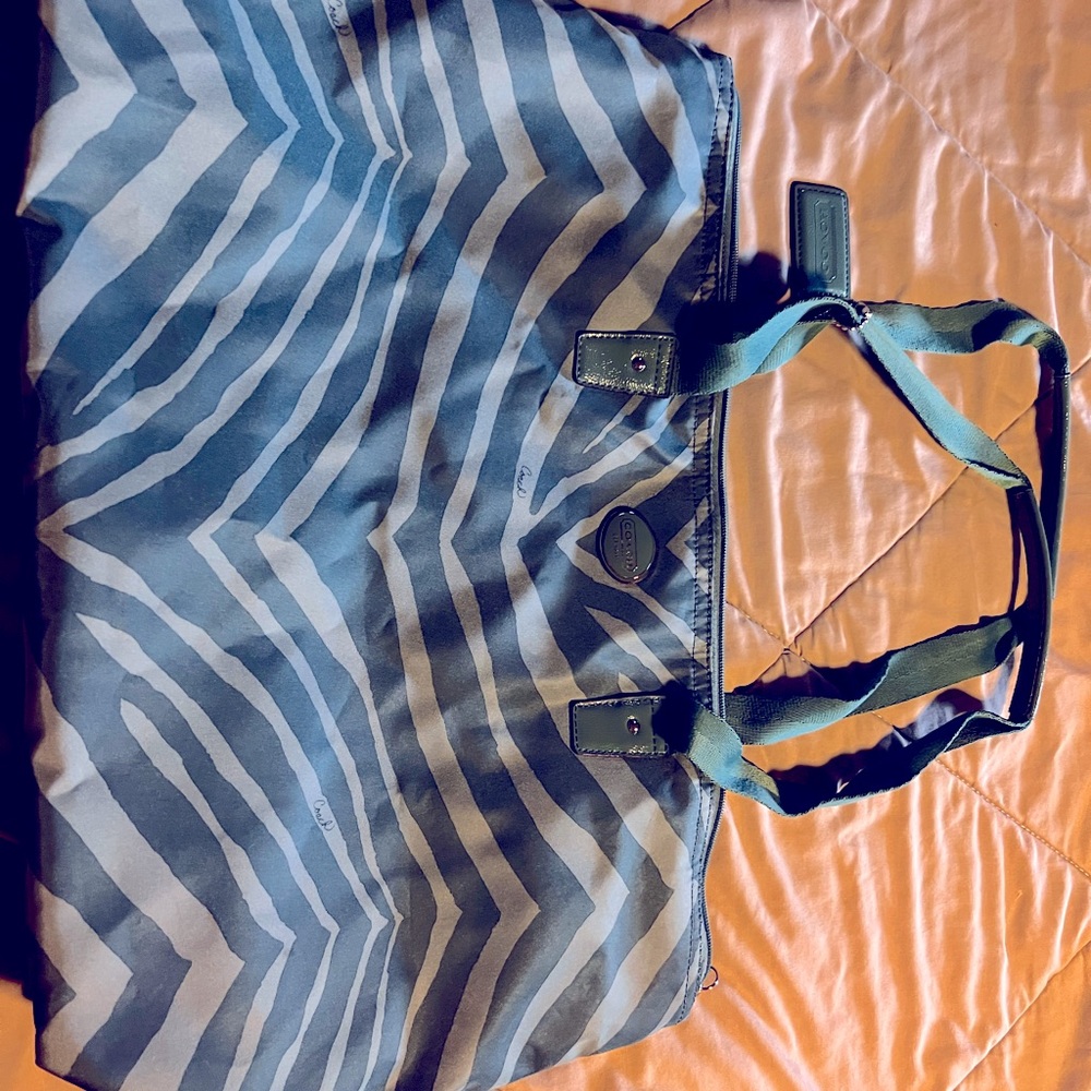Green and tan Coach bag
